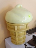 (KIT) COOKIE JAR; ICE CREAM CONE SHAPED COOKIE JAR IN CREAM AND BROWN. MEASURES 13 IN TALL