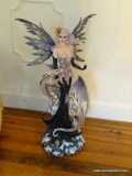 (LR) FANTASY FIGURINE; DEPICTS A FAIRY WITH A DRAGON AND AN ORB IN HER HAND SITTING ATOP A SNOWY