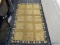 AREA RUG; BROWN AND BLACK BERBER STYLE AREA RUG IN VERY GOOD CONDITION. MEASURES 2 FT 6 IN X 4 FT 3