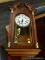 WALL CLOCK; MAHOGANY FRAMED D.E.A. WALL CLOCK WITH BRASS PENDULUM, COLUMNAR SIDES, BROKEN ARCH