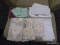 ASSORTED LINEN LOT; INCLUDES TABLE CLOTHS AND OTHER ASSORTED TABLE LINENS.