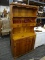 TWO PIECE VINTAGE BREAKFRONT HUTCH; BOTTOM PIECE, TWO-DOOR CABINET WITH THREE DRAWERS ON TOP. TOP