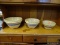 SET OF DECORATIVE BOWLS; THREE CERAMIC BOWLS VARYING IN SIZE WITH SIMILAR DESIGN PATTERNS.