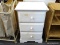 SHORT WHITE DRESSER; WHITE DRESSER WITH THREE DRAWERS, STANDING 2FT 7IN TALL, WITH THE DRESSER TOP