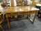 MAHOGANY TABLE WITH DRAWERS; THREE DRAWERS UNDER TABLETOP, METAL KNOBS WITH A FLORAL DESIGN. 4FT 5IN