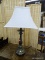BRUSHED METAL TABLE LAMP; THIS TABLE LAMP HAS WHITE FABRIC SHADE THAT SITS ON A BRUSHED GUNMETAL