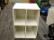 SHOE ORGANIZER; 4 SECTION WHITE SHOE ORGANIZER IN EXCELLENT CONDITION. MEASURES 12 IN X 12 IN X 1 FT