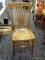 CANE BOTTOM SIDE CHAIR; WOODEN SIDE CHAIR WITH INTACT CANE SEAT. SITS ON 4 TAPERED LEGS WITH SPINDLE