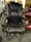 FAUX LEATHER OFFICE CHAIR; BLACK OVERSTUFFED BACK AND SEAT WITH PADDED ARENS AND SILVER TONED FRAME.