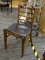 VINTAGE WOODEN SIDE CHAIR; RICH, STAINED WOODEN SIDE CHAIR WITH BOWED BACK, BLACK VINYL SEAT, AND