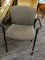 OFFICE CHAIR; CHARCOAL GREY UPHOLSTERED BACK AND SEAT WITH CURVED ARMS AND BLACK FRAME. MEASURES 2