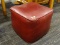 VINTAGE OTTOMAN; DARK RED VINYL UPHOLSTERED CUBE SHAPED OTTOMAN/FOOT STOOL. MEASURES 1 FT 3.5 IN X 1