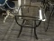 GLASS TOP SIDE TABLE; SQUARE BEVELED GLASS TOP SITTING ON A BLACK METAL BASE WITH A MARBLED-LOOK