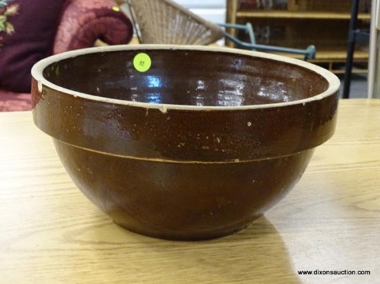 VINTAGE POTTERY BOWL; BROWN GLAZED POTTERY BOWL WITH CREAM COLORED RIM. MEASURES 5 IN TALL X 10 IN