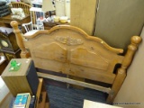 QUEEN SIZE BED; PINE CANNONBALL POST BED WITH WOODEN RAILS. IS IN EXCELLENT CONDITION AND MEASURES 5