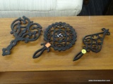 VIRGINIA METALCRAFTERS LOT; INCLUDES 3 CAST IRON VIRGINIA METALCRAFTERS TRIVETS IN EXCELLENT