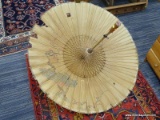 ANTIQUE ORIENTAL UMBRELLA; HAND PAINTED SCENE ON RICE PAPER WITH A WOODEN HANDLE. IS IN GOOD