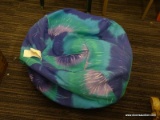 BEAN BAG CHAIR; TYE DYE PATTERN BEAN BAG CHAIR IN HUES OF GREEN, BLUE, AND PURPLE.