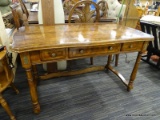 MAHOGANY TABLE WITH DRAWERS; THREE DRAWERS UNDER TABLETOP, METAL KNOBS WITH A FLORAL DESIGN. 4FT 5IN