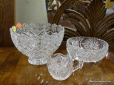 CRYSTAL LOT; INCLUDES THREE PIECES OF CRYSTAL, A LARGE CANDY BOWL, A SMALL CREAMER, AND A MEDIUM