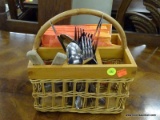 SILVERWARE AND CARRIER BASKET; LOT OF SILVERWARE AND NAPKINS IN A WICKER SILVERWARE BASKET.