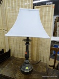 BRUSHED METAL TABLE LAMP; THIS TABLE LAMP HAS WHITE FABRIC SHADE THAT SITS ON A BRUSHED GUNMETAL