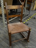 RUSH BOTTOM ROCKING CHAIR; VINTAGE WOODEN ROCKING CHAIR WITH MULE EAR BACK AND RUSH BOTTOM SEAT.