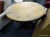 ROUND DROP LEAF DINING TABLE; WORN ROUND WOOD GRAIN TOP WITH SPLIT CENTER, AND NAVY BLUE PEDESTAL