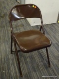 METAL FOLDING CHAIR; BROWN METAL FOLDING CHAIR. MEASURES 1 FT 6 IN X 1 FT 4 IN X 2 FT 5 IN.