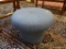 (LR) OTTOMAN; ROUND BLUE UPHOLSTERED OTTOMAN- 18IN DIA X 13 IN H