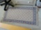 (BR1) RUG; ORIENTAL STYLE MACHINE MADE RUG IN IVORY AND LIGHT BLUE- 23 IN X 46 IN