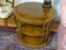(LR) END TABLE- OVAL WALNUT END TABLE WITH BANDED INLAID TOP COLUMNED SUPPORTS AND 2 SHELVES- 29 IN