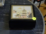 (LR) ORIENTAL MUSIC BOX- BLACK LACQUER AND METAL EMBOSSED LID ORIENTAL JEWELRY/ MUSIC BOX- 5 IN X 5