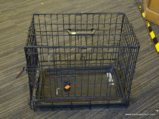 FOUR PAWS DOG CAGE; BLACK METAL FOUR PAWS K-9 KEEPER PORTABLE SMALL DOG CAGE. HAS TOP HANDLE AND