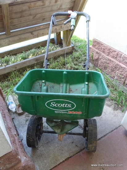 (OUT) SCOTTS SPREADER; GREEN SCOTTS SPEEDY GREEN 3000 SPREADER. HAS CRACK/BROKEN AREA IN THE HOPPER.