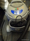 SHOP VAC CONTRACTOR SERIES WET/DRY VAC; 16 GALLON AND 6 HP VACUUM WITH HOSE ATTACHMENT.