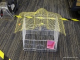 WIRE BIRD CAGE; MEDIUM SIZED WHITE AND YELLOW METAL WIRE BIRD CAGE WITH LAVA STONE PERCH, 3 FRONT