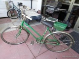 (OUT) VINTAGE PENNY'S BICYCLE; EMERALD GREEN METAL BICYCLE WITH CHROME WHEEL COVERS AND HANDLE BARS
