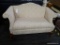 ANTIQUE CLAYTON MARCUS CAMELBACK SOFA; CLAY MARCUS CAMELBACK SOFA WITH LIGHT COLORED CREAM FABRIC