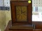 WOODEN MANTLE CLOCK; WOODEN MANTLE CLOCK, CLOCK HAS AN ART DECO STYLED FACE. MEASURES 8.5 IN X 3 IN