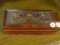 POLAND WOOD TRINKET BOX; WOOD TRINKET BOX WITH A BIRD AND FLOWER DETAILED TOP. MEASURES 7 IN X 4 IN