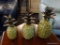 SET OF CERAMIC PINEAPPLES; SET OF 3 GRADUATED SIZE GLAZED GREEN AND TAN CERAMIC PINEAPPLES. LARGEST