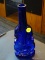 COBALT VIOLIN SHAPED VASE; COBALT BLUE SHAPED VIOLIN/CELLO SHAPED GLASS BOTTLE/VASE. MEASURES 9 IN