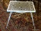 METAL PATIO TABLE; WHITE METAL OUTDOOR PATIO TABLE. MEASURES 1 FT 11.5 IN X 1 FT 4 IN X 1 FT 5.5 IN.