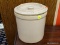 GLAZED CROCK JAR; CREAM COLORED LIDDED CROCK. MEASURES 8.5 IN X 7.5 IN DIAMETER. DOES HAVE A CHIP ON