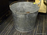 METAL BUCKET; METAL BUCKET WITH HANDLE. MEASURES 9 IN TALL WITH A 10 IN DIAMETER.