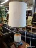 GLASS AND METAL TABLE LAMP; WHITE AND ORANGE STAINED GLASS JAR SITTING ON A METAL STAND WITH METAL