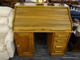 OAK ROLL TOP DESK; OAK ROLL TOP DESK WITH AN UPPER CUBBY SYSTEM WITH 6 CUBBIES AND 8 DRAWERS. BELOW