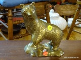 METAL BEAR STATUE; METAL STATUE OF A BEAR STANDING ON A ROCK. MEASURES 8 IN TALL.