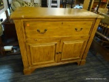 OAK ROLL FRONT DESK; OAK ROLL OUT FRONT AND FLIP DOWN DESK WITH METAL POLES, 6 CUBBIES, AND 8